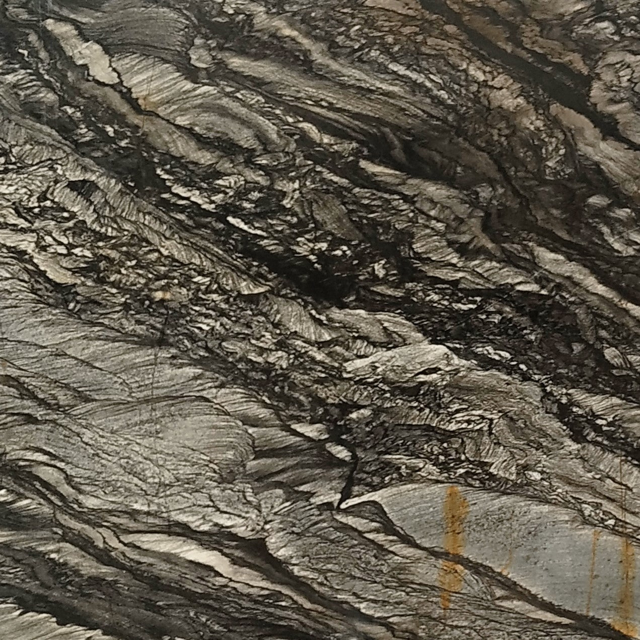 Black Sansalus Granit – Hochwertiger Naturstein mit schwarz-grauer Maserung und dynamischer Struktur, ideal für moderne Innen- und Außenbereiche.