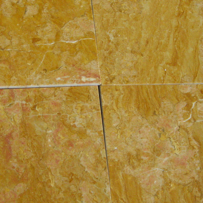 Giallo Reale Natursteinfliesen im Close Up. Die Fliese ist gelb gold mit teils rot-weißer Maserung.