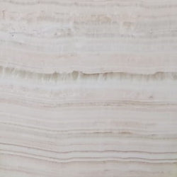 Ivory Onyx – Hochwertiger, transluzenter Naturstein mit einzigartiger Maserung, ideal für luxuriöse Innenraumgestaltung.

