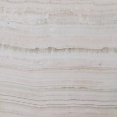 Ivory Onyx – Hochwertiger, transluzenter Naturstein mit einzigartiger Maserung, ideal für luxuriöse Innenraumgestaltung.

