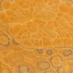 Terracotta Onyx – Hochwertiger, transluzenter Naturstein mit einzigartiger Maserung, ideal für luxuriöse Innenraumgestaltung.

