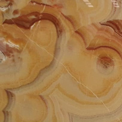 Rainbow Onyx – Hochwertiger, transluzenter Naturstein mit einzigartiger, mehrfarbiger Maserung, ideal für luxuriöse Innenraumgestaltung.

